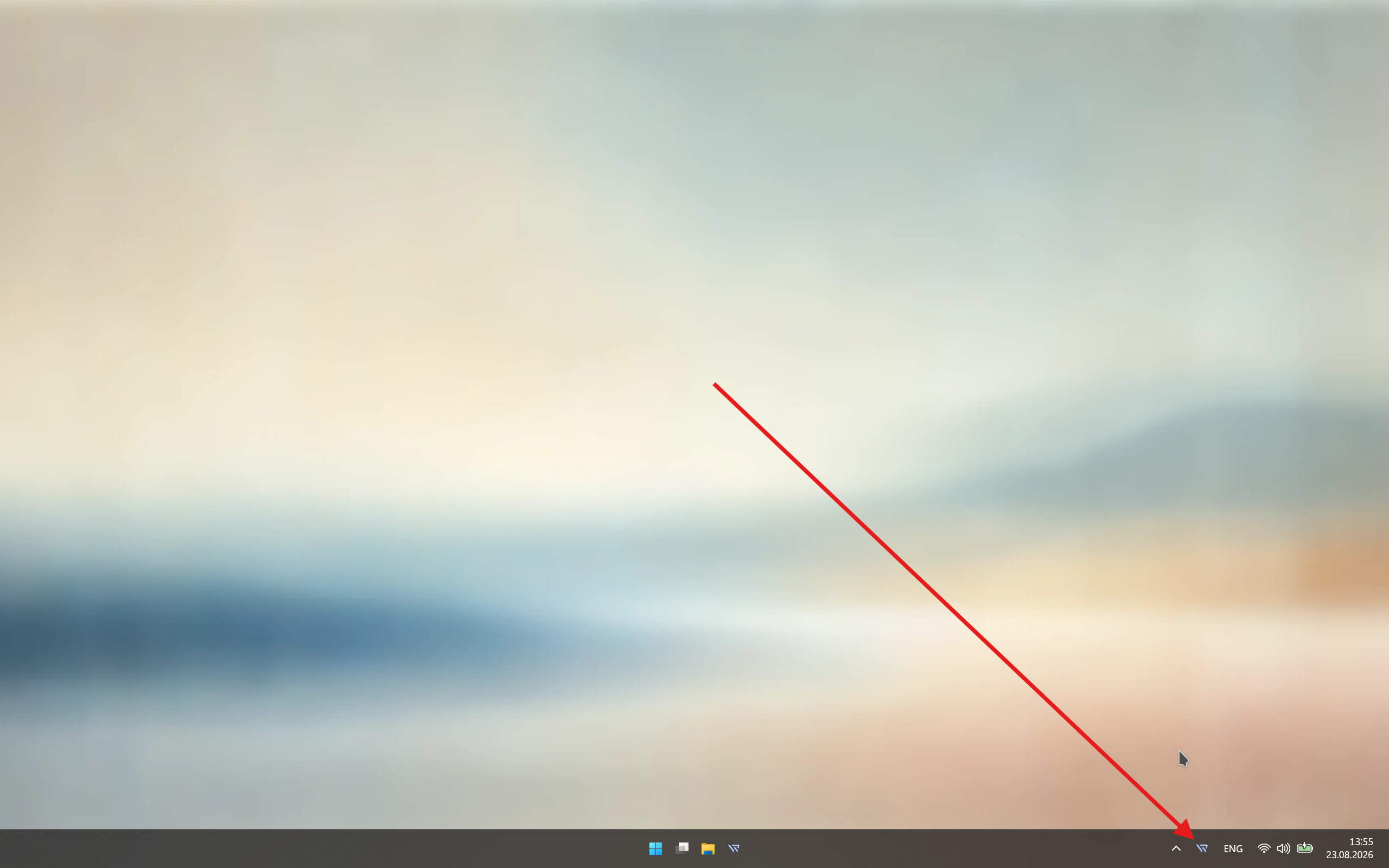 Oppgavelinjen i Windows med en pil som peker på Waypad-ikonet i varslingsområdet